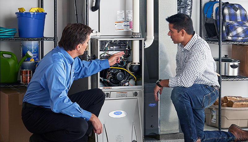 HVAC technician evaluating a furnace for repair or replacement in Firestone